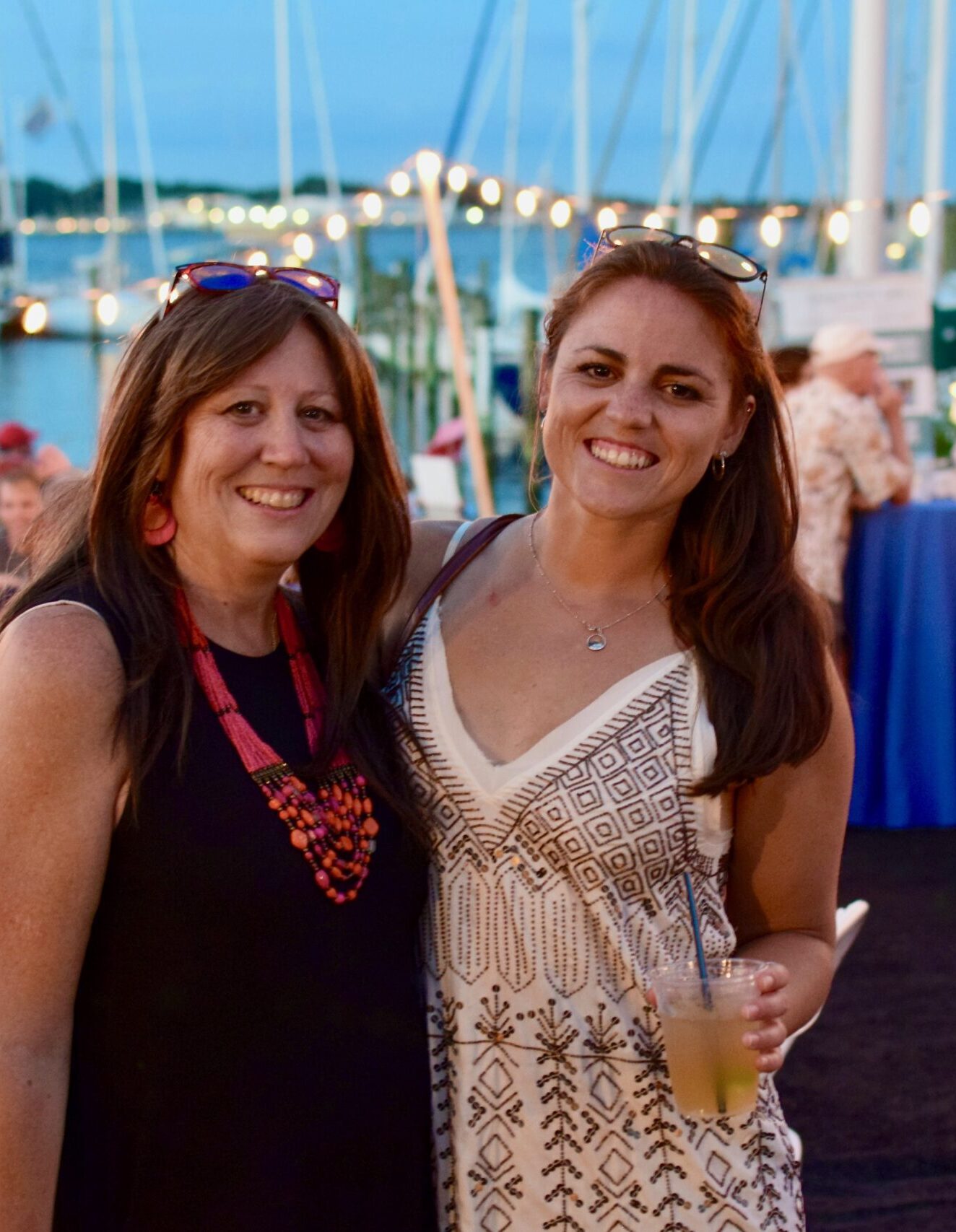Photo of two female guests enjoying the after-regatta festivities. 