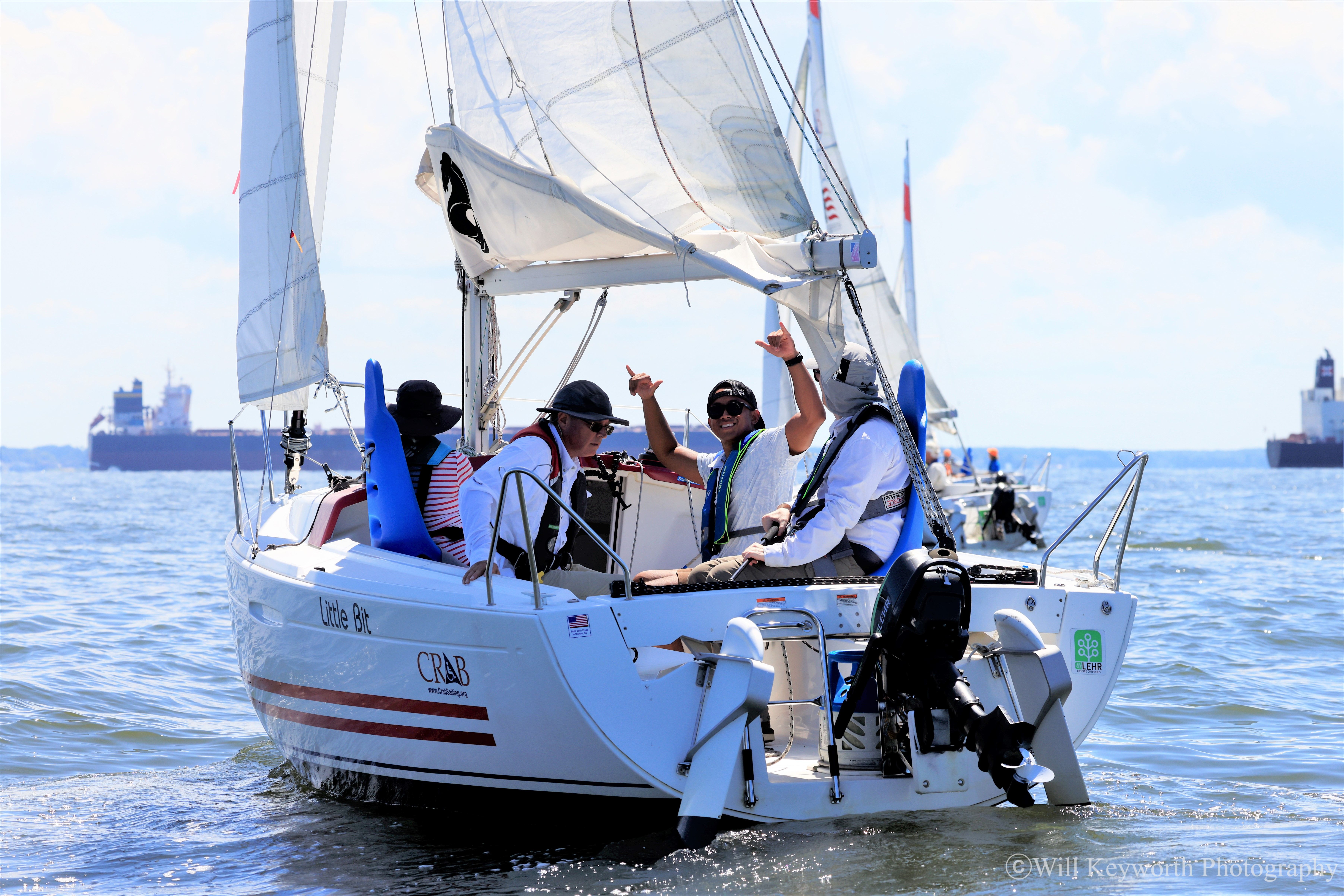 Photo of one of the CRAB sailboats and participants on the water during the regatta. 