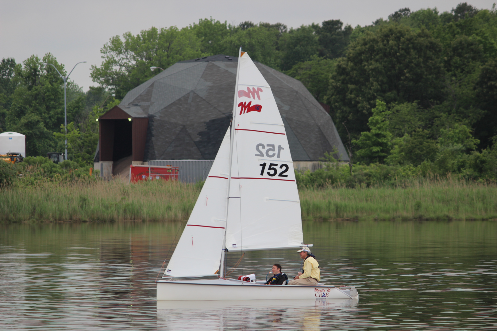 Photo of a guest and volunteer enjoying a sail on the CRAB Martin 16 equipped with Sip/Puff steering. 
