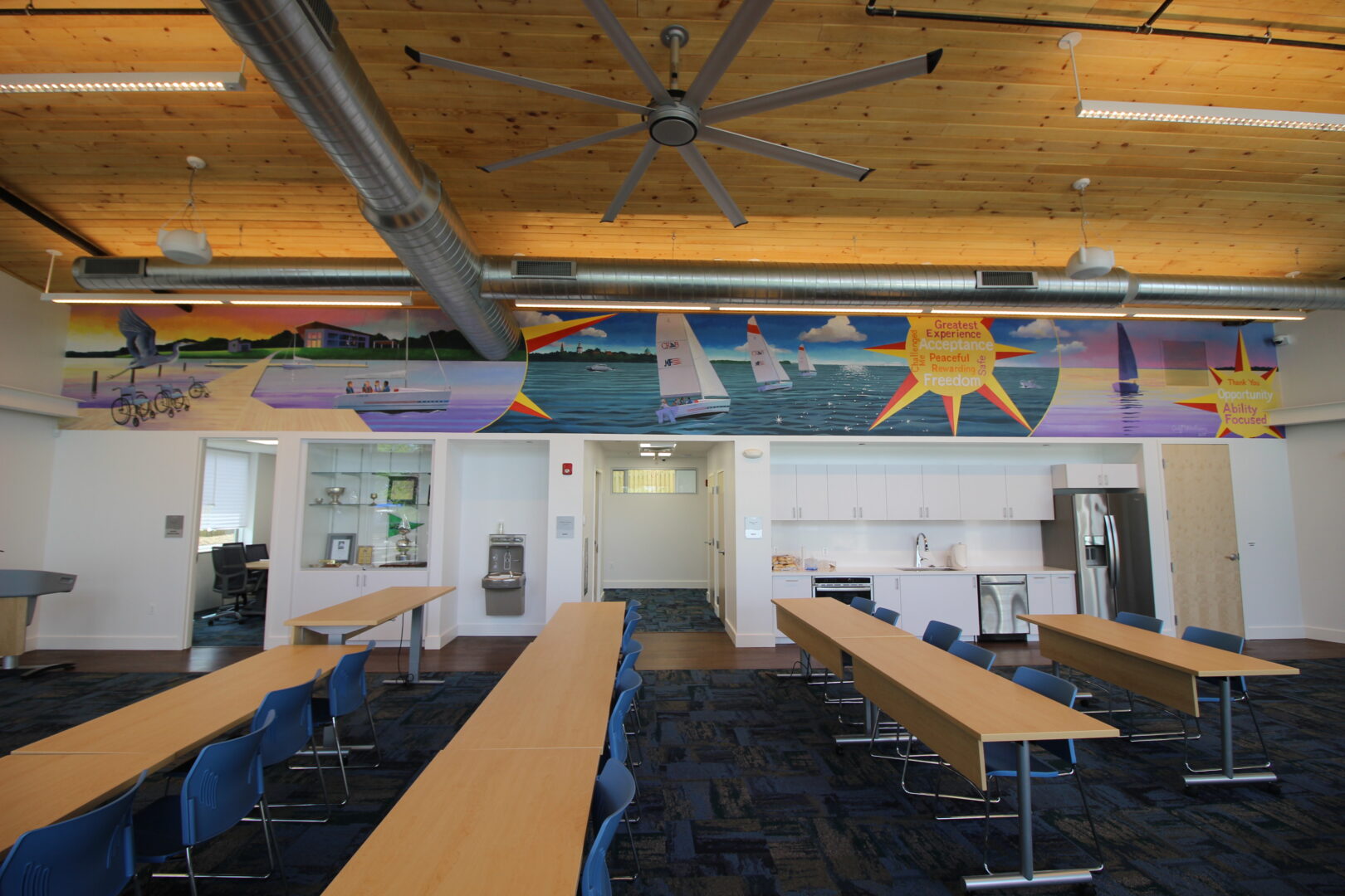 Photo of the ABC lobby set up with adjustable height tables in classroom style setting. 