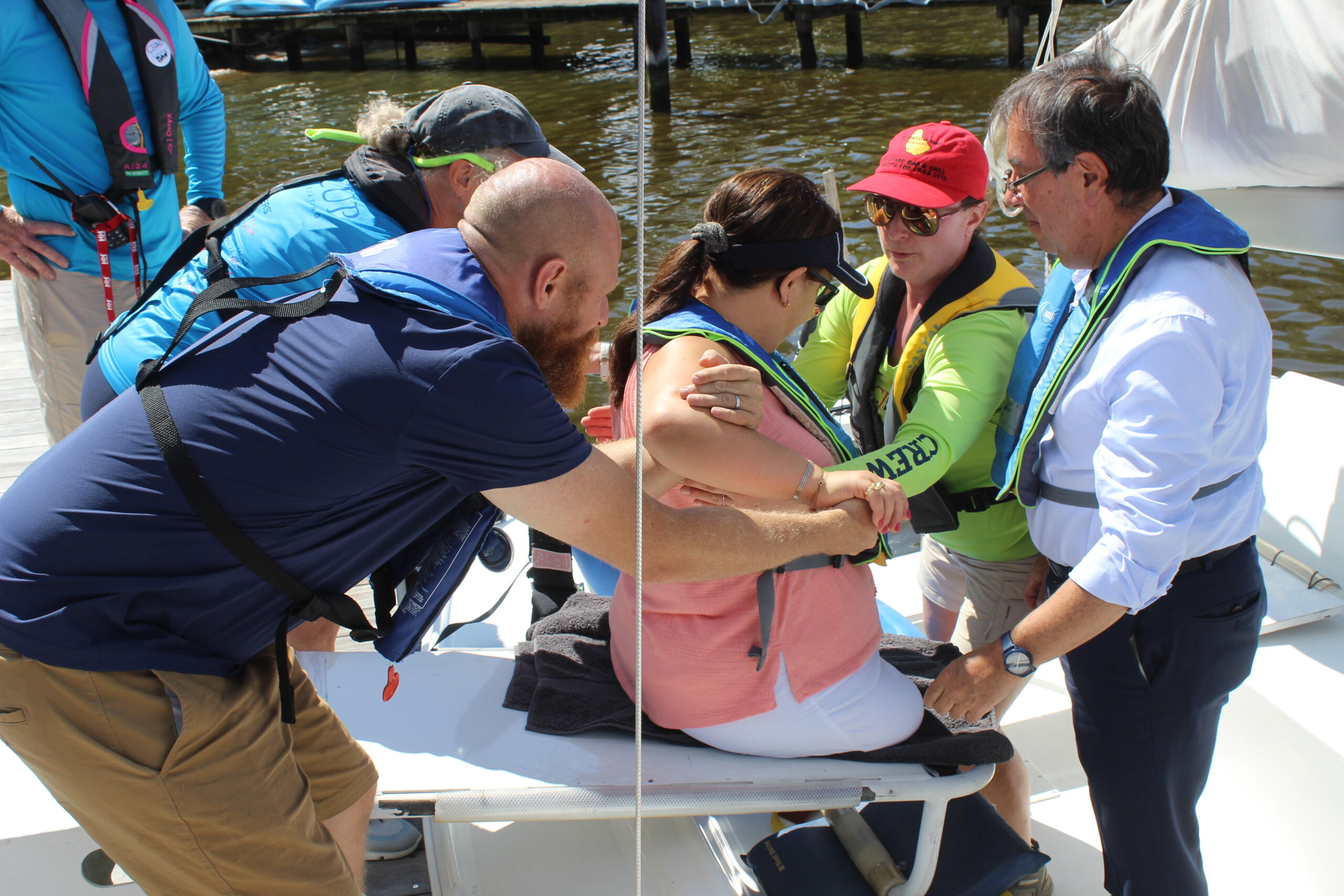 A photo of CRAB volunteers helping a guest using the transfer box to move from the dock to a CRAB sailboat. 